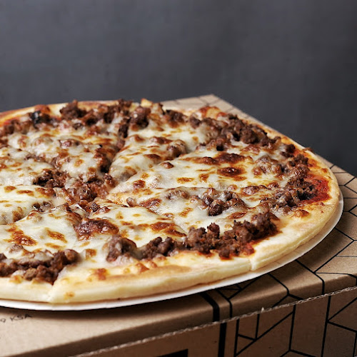 يم يم بيتزا (فرع الرس)