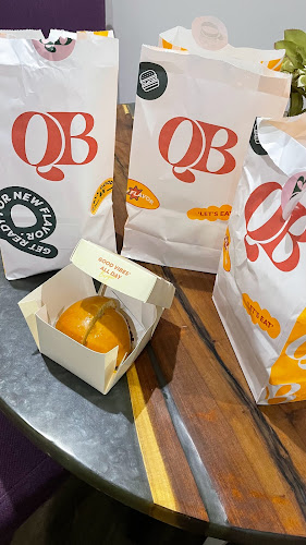 كيو بي برغر - الضيافة