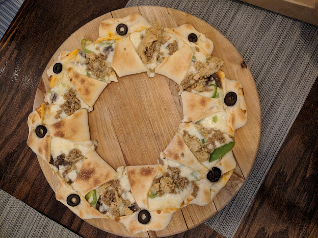 طبق البيتزا - القطيف‎